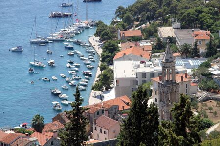 Boats in harbor and buildings of Hvar, Croatia のeditorial素材