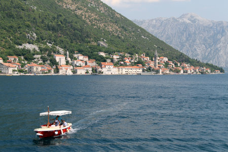 Boat and town Perast in Boka Kotorska, Montenegro