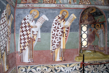 Pictures on the wall and window of church in monastery Moracha, Montenegroのeditorial素材