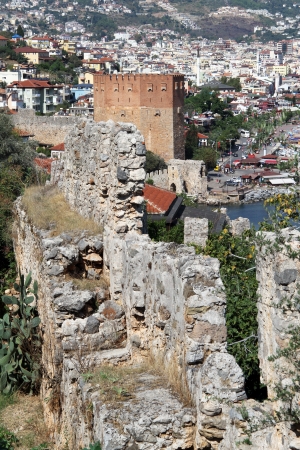 Red tower and wall near sea in Alanya, Turkeyのeditorial素材