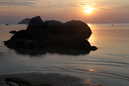 Rock and sunset in Ko Phangan, Thailandの写真素材