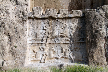 Bas-relief with battle on the wall of royal tomb in Naqsh-e Rostam, Iran
