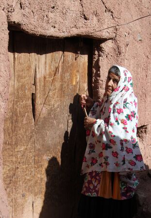 ABYANEH, IRAN - CIRCA APRIL 2013 Old womanのeditorial素材