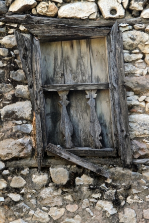 Wooden window and stone wall of old turkish house, Turkeyの写真素材