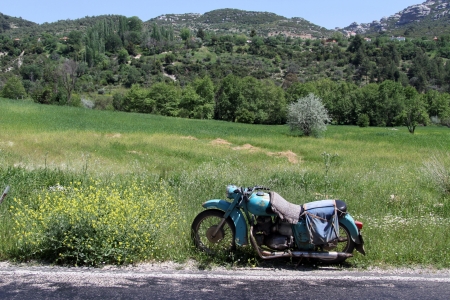 Old bike near the roadの写真素材