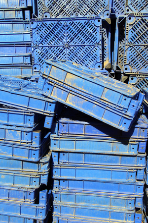 Heap of plastic blue boxes in many rowsの写真素材