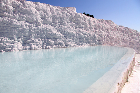 Clean water in pool and travertine in Pamukkale, Turkeyの写真素材