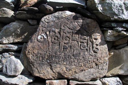 Stone with cacred letters in the wall in Nepalの写真素材