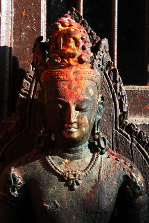 Head of Buddha statue near the brick wall in temple