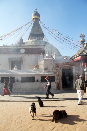 People walk near stupa Bodnth in Kathmandu, Nepalのeditorial素材