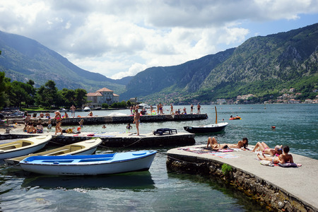 KOTOR, MONTENEGRO - CIRCA AUGUST 2014 People on the coast of Boka Kotorska                               のeditorial素材