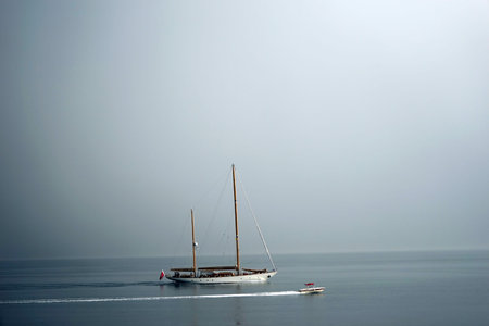 Yacht and boat in Kotor bay at cloudy day, Montenegroの写真素材