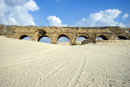 Track near ruins of aqueduct of Caesarea, Israelの写真素材