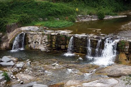 Small damm on the river in Ceravezza, Italyの写真素材