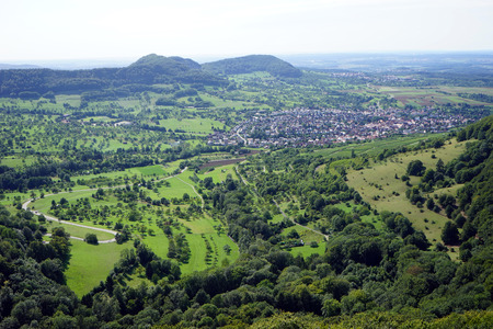 Neuffen town in green valley in Swabia, Germanyの写真素材