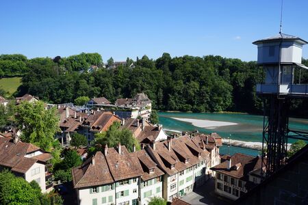 BERN, SWITZERLAND - CIRCA AUGUST 2015 Embankment of Aare river and towerのeditorial素材
