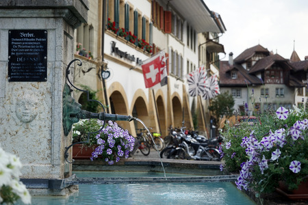MURTEN, SWITZERLAND - CIRCA AUGUST 2015 Fountain with drinking water on the main street of Old townのeditorial素材