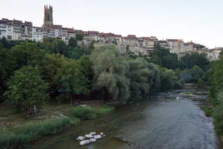 FRIBOUTG, SWITZERLAND - CIRCA AUGUST 2015 Old town and park near river Sarine