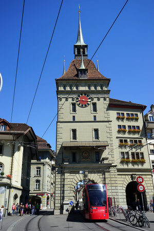 BERN, SWITZERLAND - CIRCA AUGUST 2015 Clock tower and tram on the Kramgasse