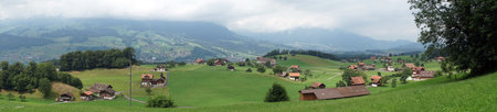 Village in green valley in rural area of Switzerland