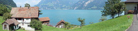 BAUEN, SWITZERLAND - CIRCA AUGUST 2015 Farm house and Lucerne lake