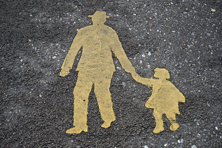 Yellow sign of man ad girl on the sidewalk