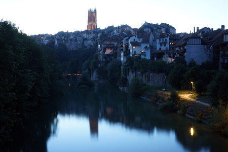 FRIBOUTG, SWITZERLAND - CIRCA AUGUST 2015 Old town and river Sarine (Saane) at night