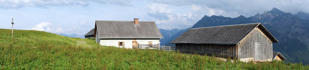 Cross and farm houses in mountain area of Lichtenstein