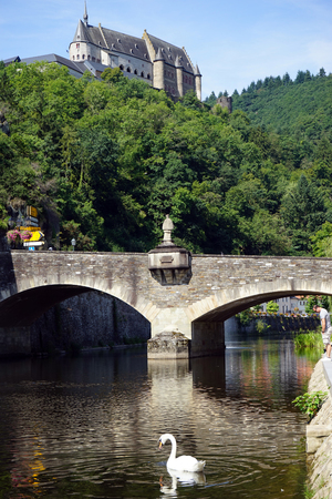 Castle on the hill and stone arch bridge on the river Our in Vianden, Luxembourgのeditorial素材