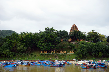 NHA TRANG, VIETNAM - CIRCA JANUARY 2017 Po Nagar towers on the hill near the river with fishman's boatsのeditorial素材