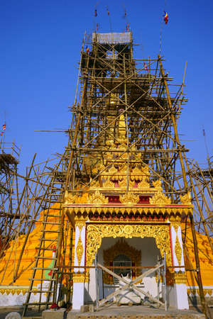 Restoration of yellow stupa in Aungpan, Myanmarのeditorial素材