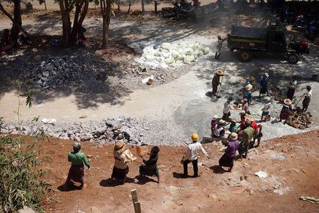 PINDAYA, MYANMAR - CIRCA APRIL 2017 People work near entrance of Pindaya cavesのeditorial素材