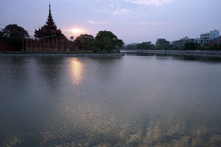 MANDALAY, MYANMAR - CIRCA APRIL 2017 Wall of Royal palace and sunriseのeditorial素材