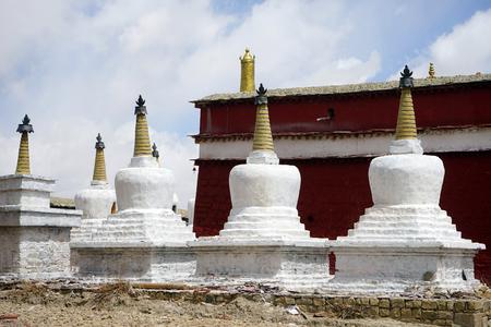 White stupas in buddhist monastery in Tibet, Chinaのeditorial素材