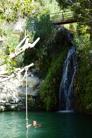 PAPHOS, CYPRUS - CIRCA OCTOBER 2017 Man in the Adonis bathsのeditorial素材