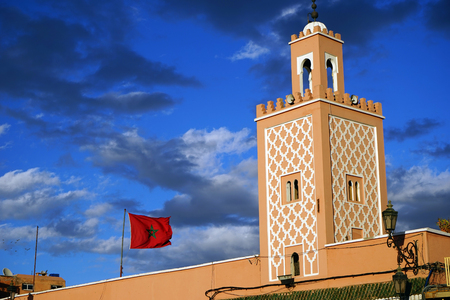 Minaret and flag in Moroccoの写真素材