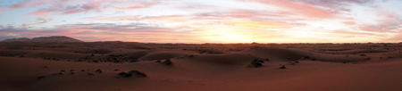 Sunrise in Sahara desert near Merzuga village in Moroccoの写真素材