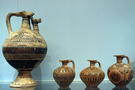 HERAKLION, GREECE - CIRCA MAY 2018 Vases on the shelf in Acrhaeological museumのeditorial素材