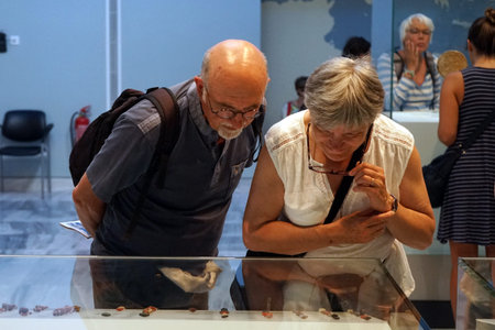 HERAKLION, GREECE - CIRCA MAY 2018 Tourists in Acrhaeological museum