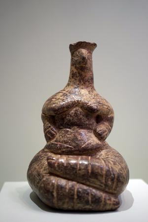 HERAKLION, GREECE - CIRCA MAY 2018 A seated female figurine made of cla in Acrhaeological museumのeditorial素材
