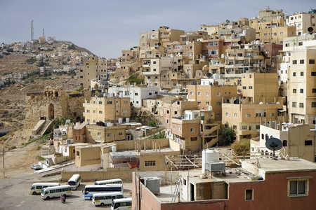 AL-KARAK, JORDAN - CIRCA NOVEMBER 2018 Houses on the hill in the center of town and bus stationのeditorial素材