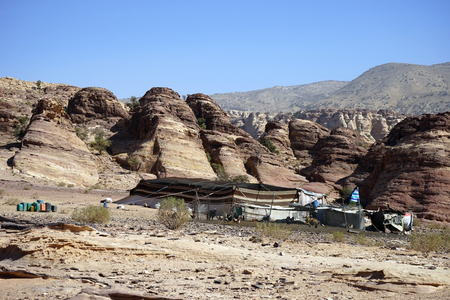 PETRA, JORDAN - CIRCA NOVEMBER 2018 Bedouin tent and chikensの写真素材