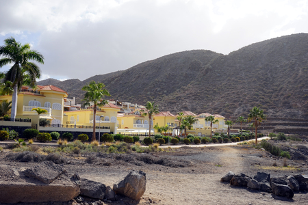 LOS CRISTIANOS, SPAIN - CIRCA FEBRUARY 2019 Recidential district near hillのeditorial素材