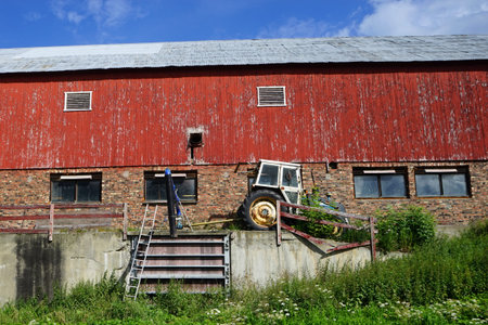 Tractor and wooden barn in Norwayの写真素材