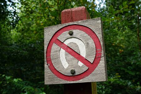 Wooden horseshoe sing in the forest in Denmarkの写真素材