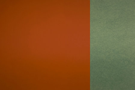 green and orange paper background with copy space for text or image.
