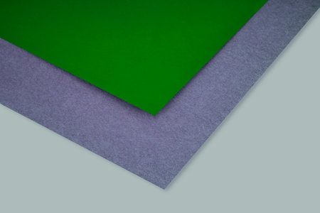 Colored papers geometry composition with light green and dark gray copy spaceの写真素材
