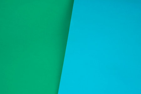 Green and blue color paper background with copy space for text or imageの写真素材