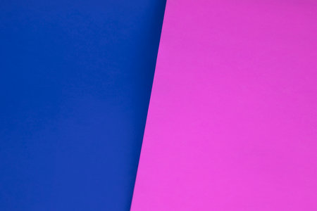 Color papers geometry composition background with pink, blue and violet tones.の写真素材