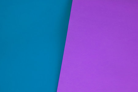 Colored papers geometry flat lay background with purple, blue and violet tonesの写真素材
